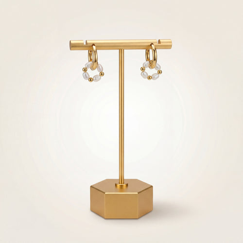 Cercle gold hoops shown as a pair, each with a looped strand of pearls and gold beads