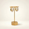 Ivoire two-tone gold and ivory hoops with a squared U-shaped silhouette
